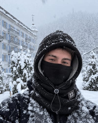 Customer wearing black hood in snowy weather
